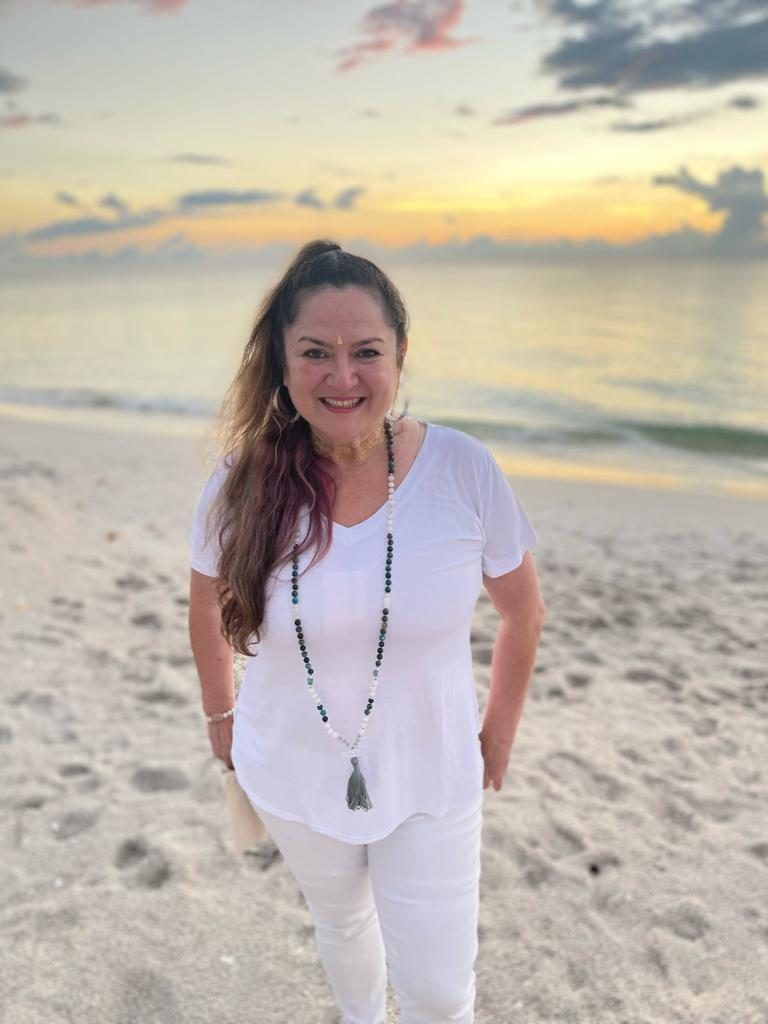 Claudia Cauterucci on the beach at sunset